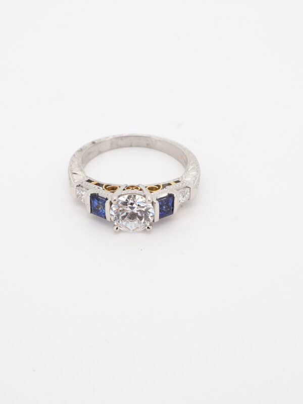 Platinum and 18KY Sapphire, Diamond, and CZ Ring